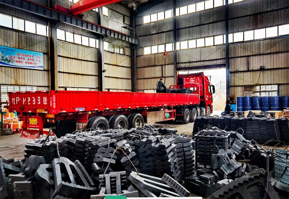 What are the main functions of a ball mill liner?